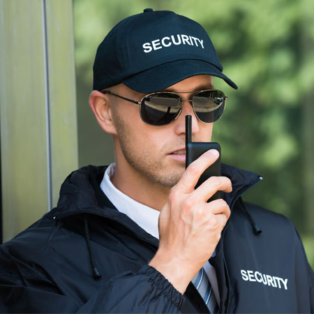 Security Guard Holding Walkie Talkie 